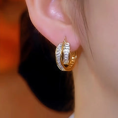 Model showcasing the dangle and style of the 14K Gold-Plated Luxury Crystal Geometric Earrings