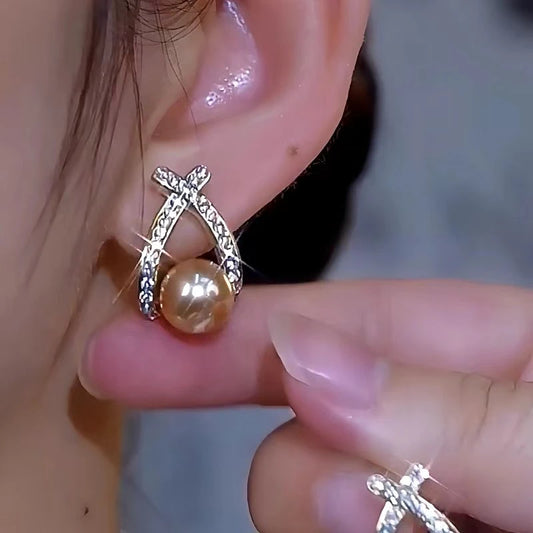 Model showcasing the dangle and style of the 14K Gold-Plated Luxury Daimond Pearl Earrings