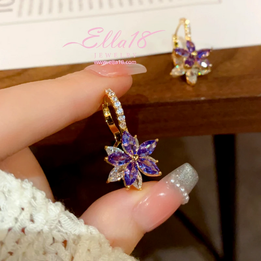 Model showcasing the dangle and style of the 14K Gold-Plated Luxury Design Purple Zircon Diamond Flower Earrings