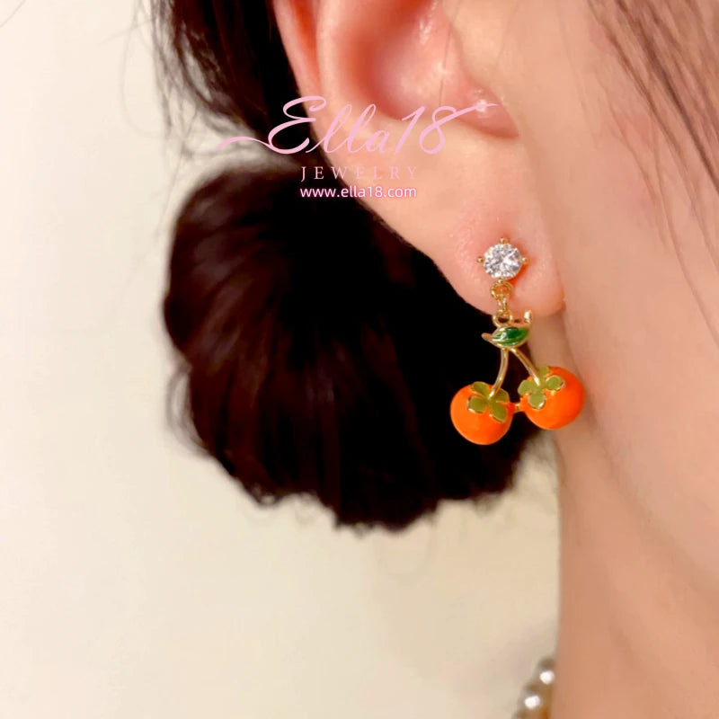 Close-up detail of the sparkling zircons and plating on the Persimmon Fruit Earrings