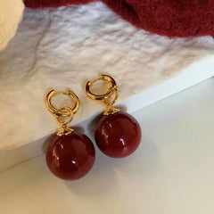 Close-up detail of the sparkling zircons and plating on the Two-Piece Pearl Earrings