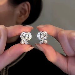 Close-up detail of the sparkling zircons and plating on the Zircon Rose Earrings