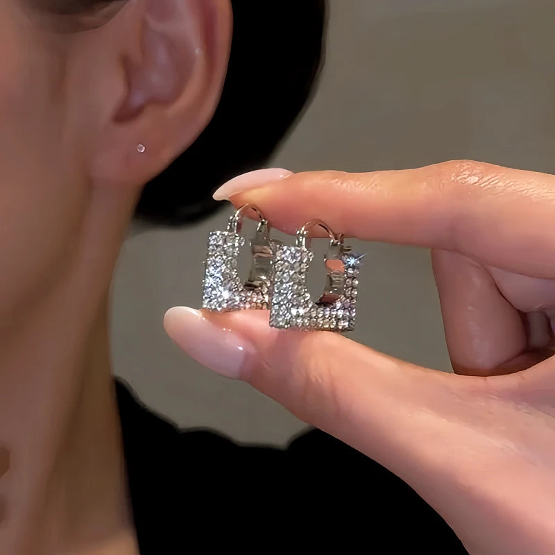 Close-up detail of the sparkling zircons and plating on the Bag-Shaped Earrings
