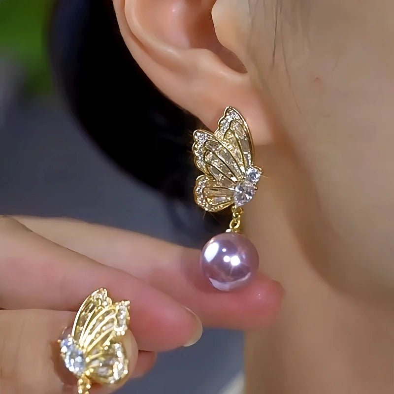 Close-up detail of the sparkling zircons and plating on the Butterfly Pearl Earrings