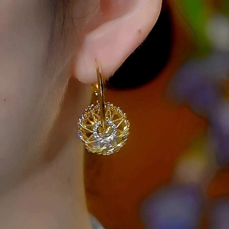 Close-up detail of the sparkling zircons and plating on the Hollow Crystal Earrings
