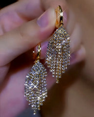 Close-up detail of the sparkling zircons and plating on the Leaf Tassel Earrings