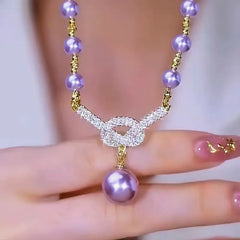 Close-up of the pendant and clasp on the Purple Pearl Necklace