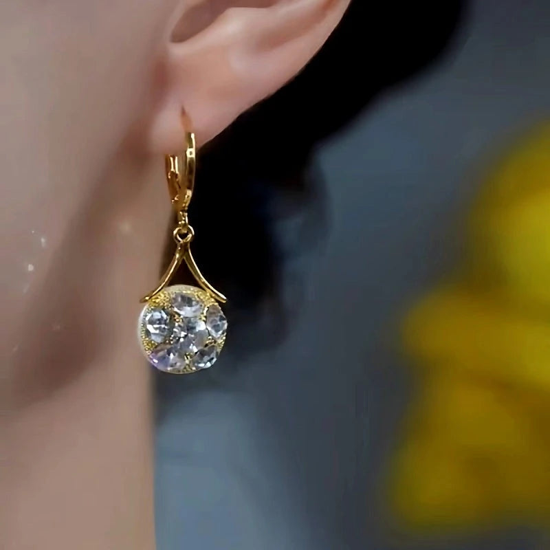 Close-up detail of the sparkling zircons and plating on the Double-Sided Pearl Earrings