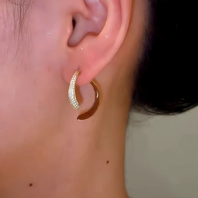 Close-up detail of the sparkling zircons and plating on the Enamel Diamond Earrings