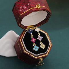 Angled view of the 14K Gold-Plated Luxury Four-Leaf Clover Tassel Earrings