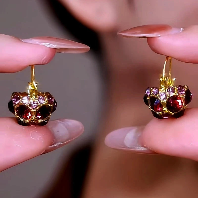 Close-up detail of the sparkling zircons and plating on the Purple Crystal Earrings