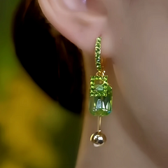 Close-up detail of the sparkling zircons and plating on the Green Tassel Earrings