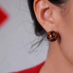 Close-up detail of the sparkling zircons and plating on the Leopard Print Earrings