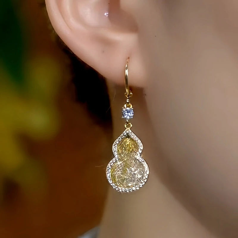 Close-up detail of the sparkling zircons and plating on the Mesh Gourd Earrings