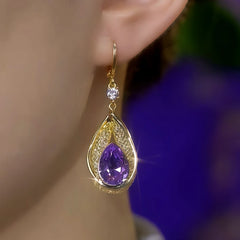 Model showcasing the dangle and style of the 14K Gold-Plated Luxury Mesh Purple Diamond Water Drop Earrings