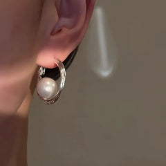 Close-up detail of the sparkling zircons and plating on the Large Pearl Hoops