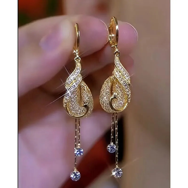 Close-up detail of the sparkling zircons and plating on the Phoenix Tassel Earrings