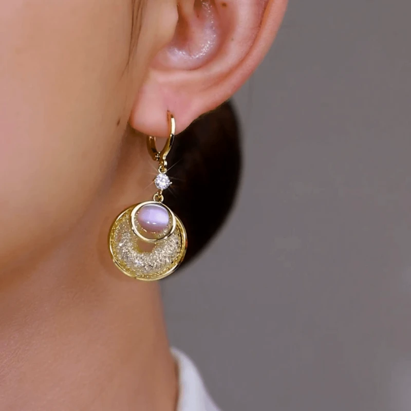 Close-up detail of the sparkling zircons and plating on the Pink Cat's Eye Earrings