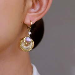 Close-up detail of the sparkling zircons and plating on the Pink Cat's Eye Earrings