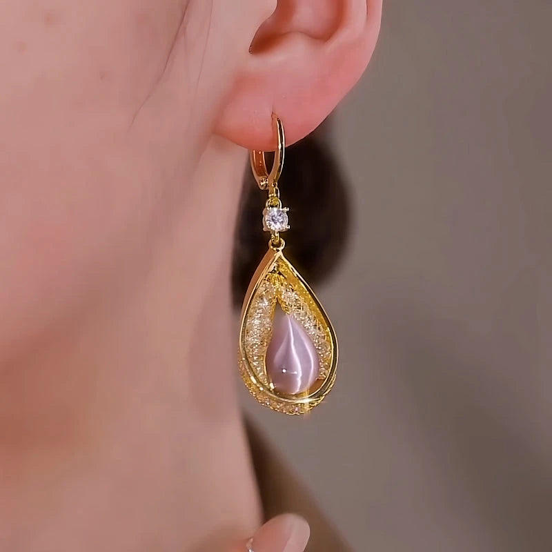 Close-up detail of the sparkling zircons and plating on the Pink Water Drop Earrings