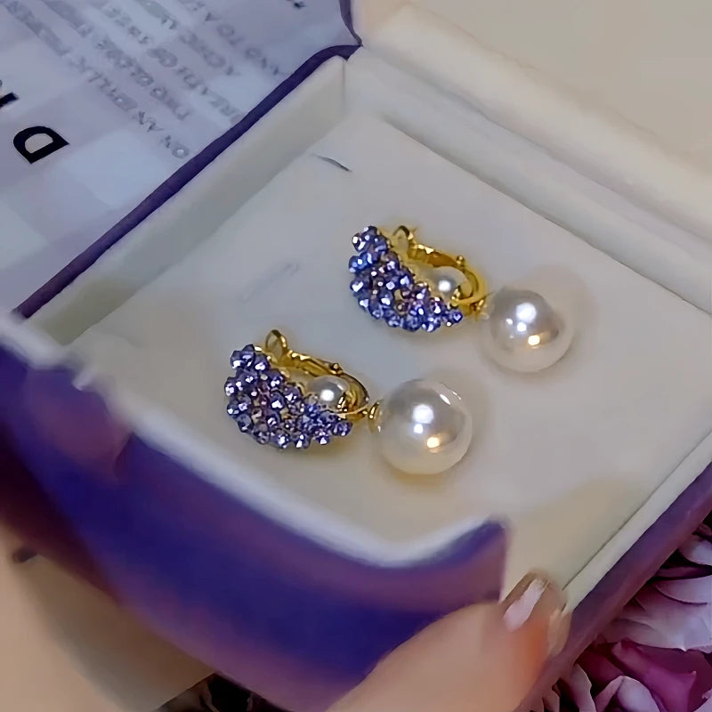 Close-up detail of the sparkling zircons and plating on the Heart Pearl Earrings