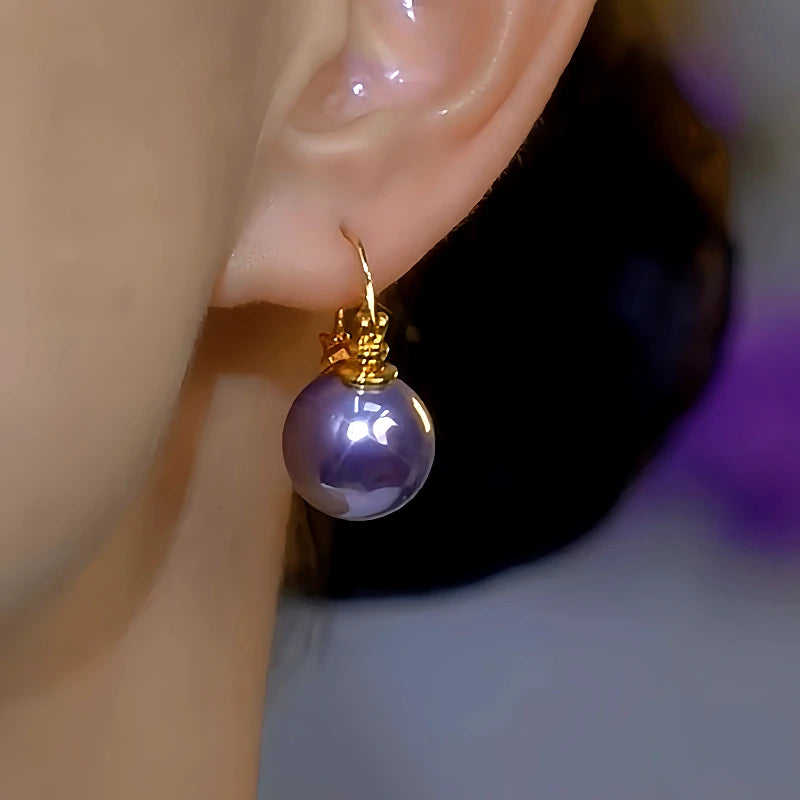 Close-up detail of the sparkling zircons and plating on the Swirl Pearl Earrings