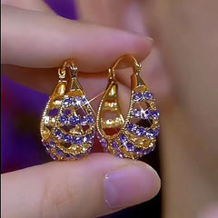 Close-up detail of the sparkling zircons and plating on the Purple Zircon Hoops