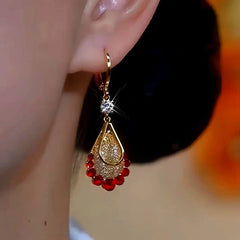 Close-up detail of the sparkling zircons and plating on the Red Water Drop Earrings