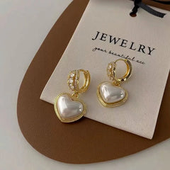 Close-up detail of the sparkling zircons and plating on the Rhinestone Heart Earrings