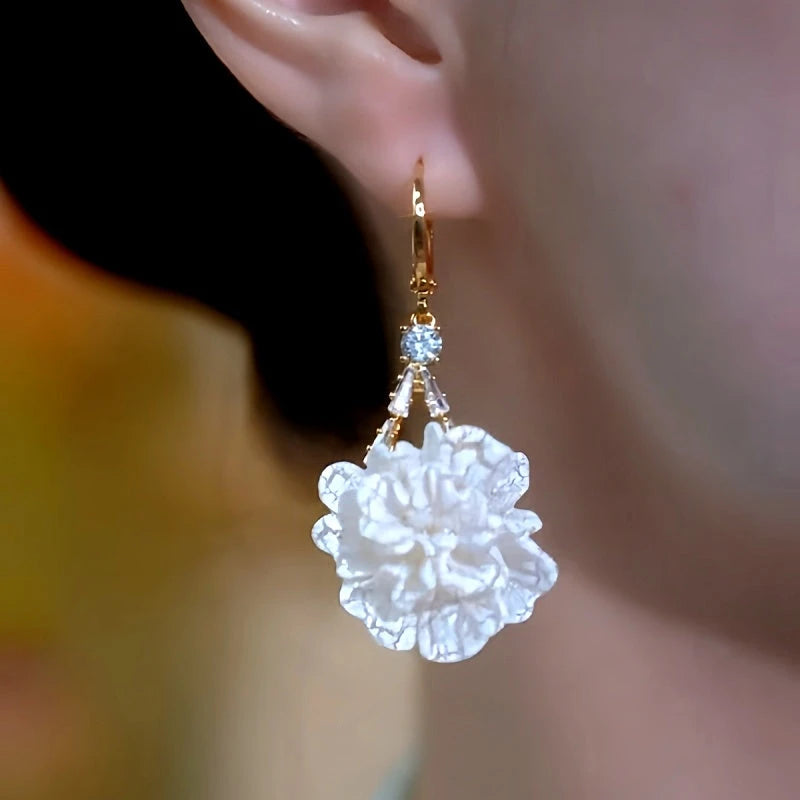 Model showcasing the dangle and style of the 14K Gold-Plated Luxury Rich Lady Super Fairy Earrings