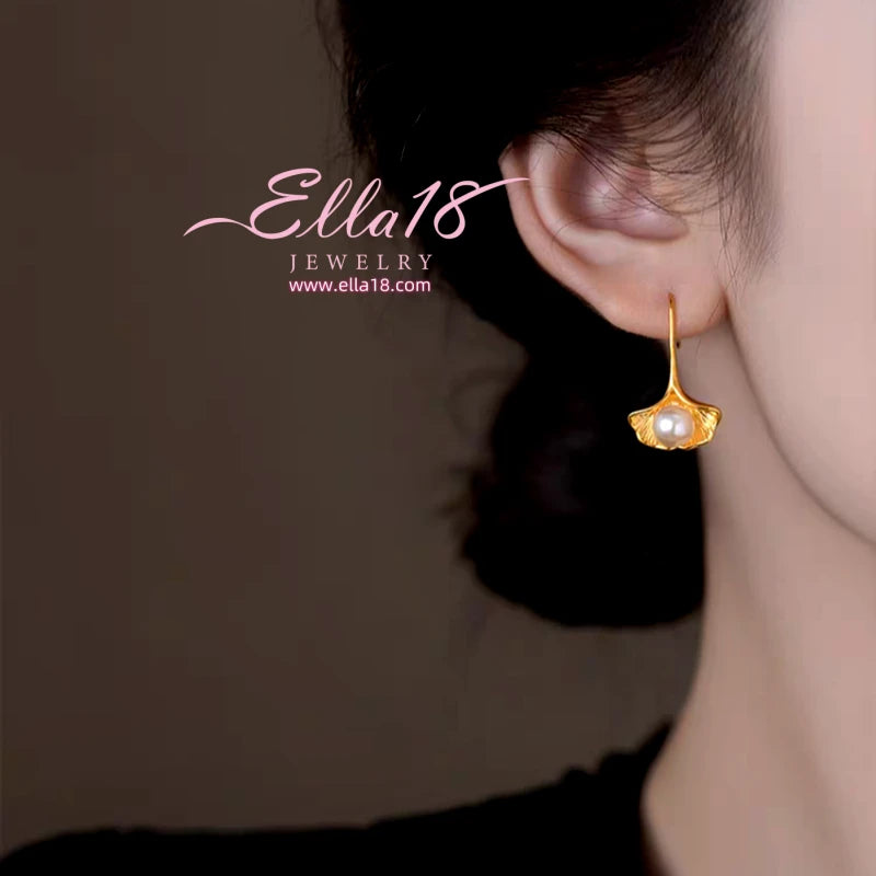 Close-up detail of the sparkling zircons and plating on the Shell Pearl Ear Hooks