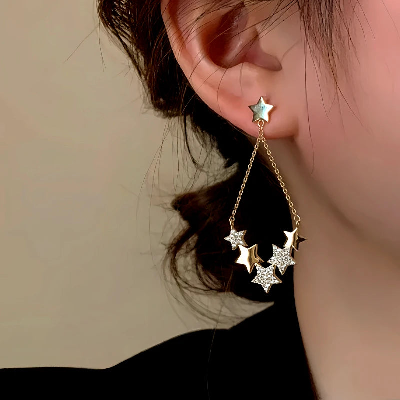 Close-up detail of the sparkling zircons and plating on the Star Tassel Earrings