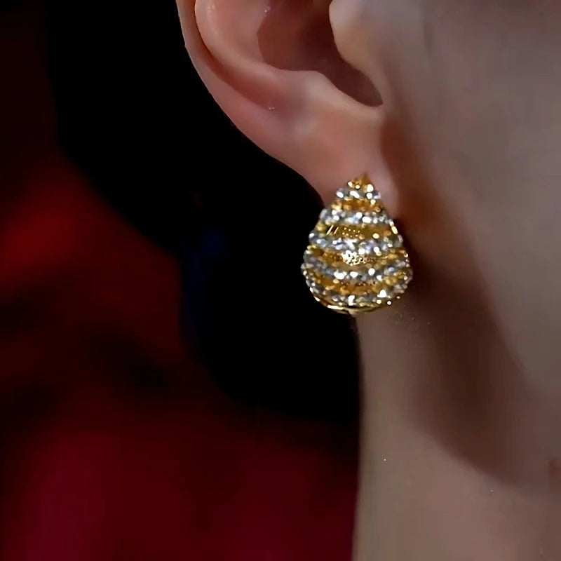 Model showcasing the dangle and style of the 14K Gold-Plated Luxury Wine Red Glaze Earrings