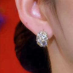 Model showcasing the dangle and style of the 14K Gold-Plated Luxury Zircon Bling Earrings