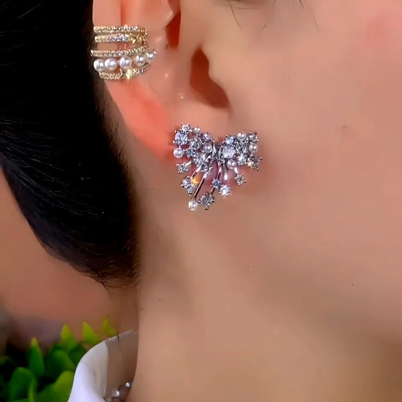 Close-up detail of the sparkling zircons and plating on the Zircon Bow Earrings