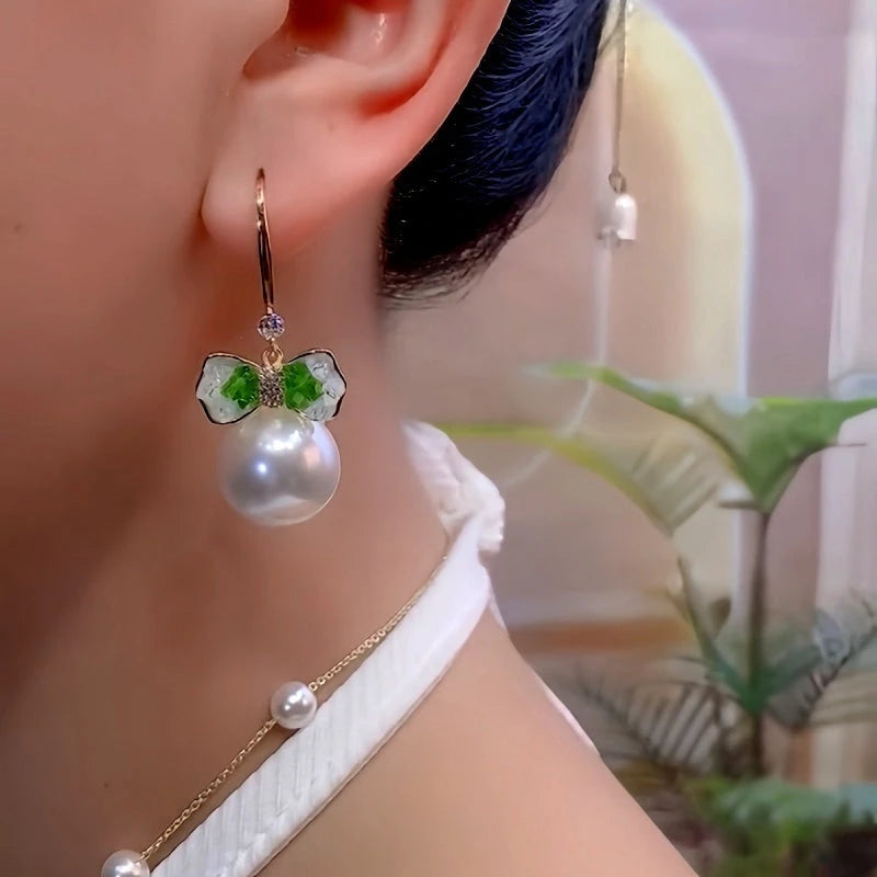 Close-up detail of the sparkling zircons and plating on the Bow Pearl Ear Hooks
