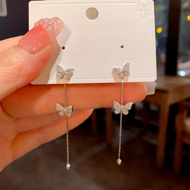 Angled view of the 14K Gold-Plated Luxury Zircon Butterfly Tassel Earrings
