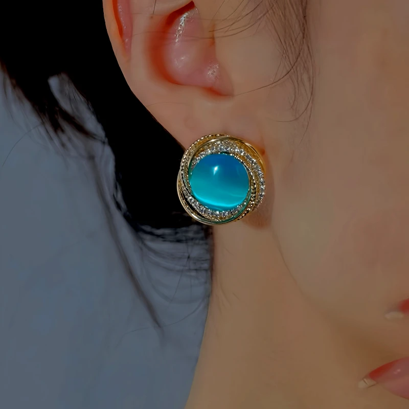 Close-up detail of the sparkling zircons and plating on the Cat's Eye Stud Earrings