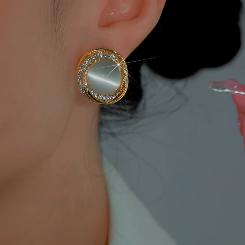 Angled view of the 14K Gold-Plated Luxury Zircon Cat's Eye Stone Stud Earrings