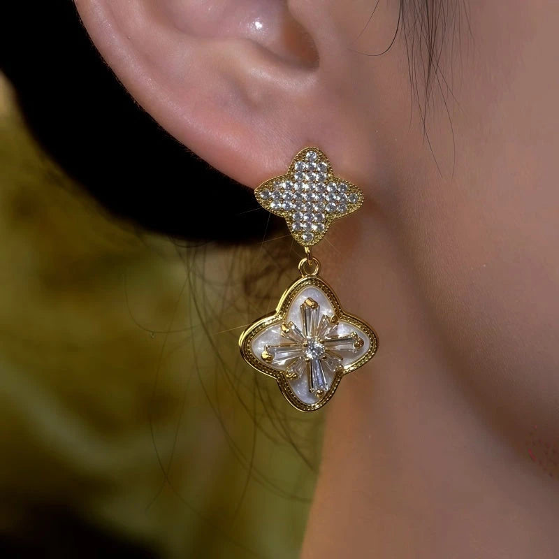 Close-up detail of the sparkling zircons and plating on the Clover Diamond Earrings