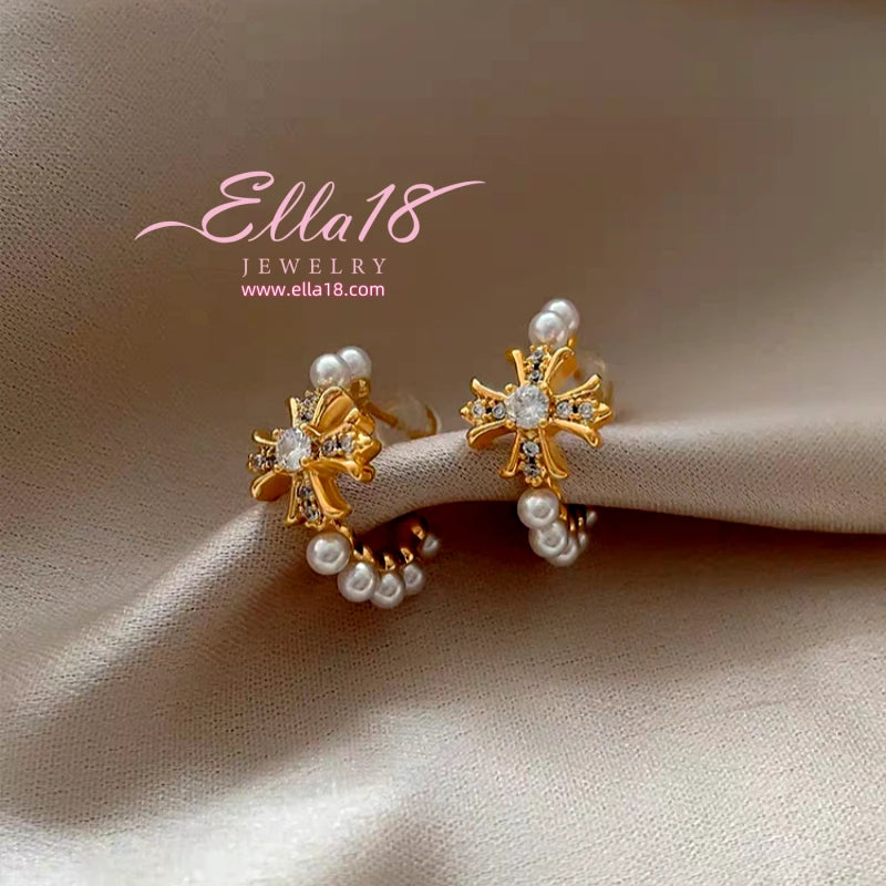Model showcasing the dangle and style of the 14K Gold-Plated Luxury Zircon Diamond Cross Pearl C-Shaped Earrings