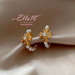 Model showcasing the dangle and style of the 14K Gold-Plated Luxury Zircon Diamond Cross Pearl C-Shaped Earrings