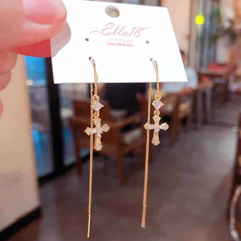 Close-up detail of the sparkling zircons and plating on the Cross Threader Earrings