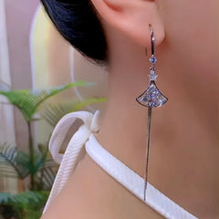 Model showcasing the dangle and style of the 14K Gold-Plated Luxury Zircon Diamond French Style Ear Hook Earrings