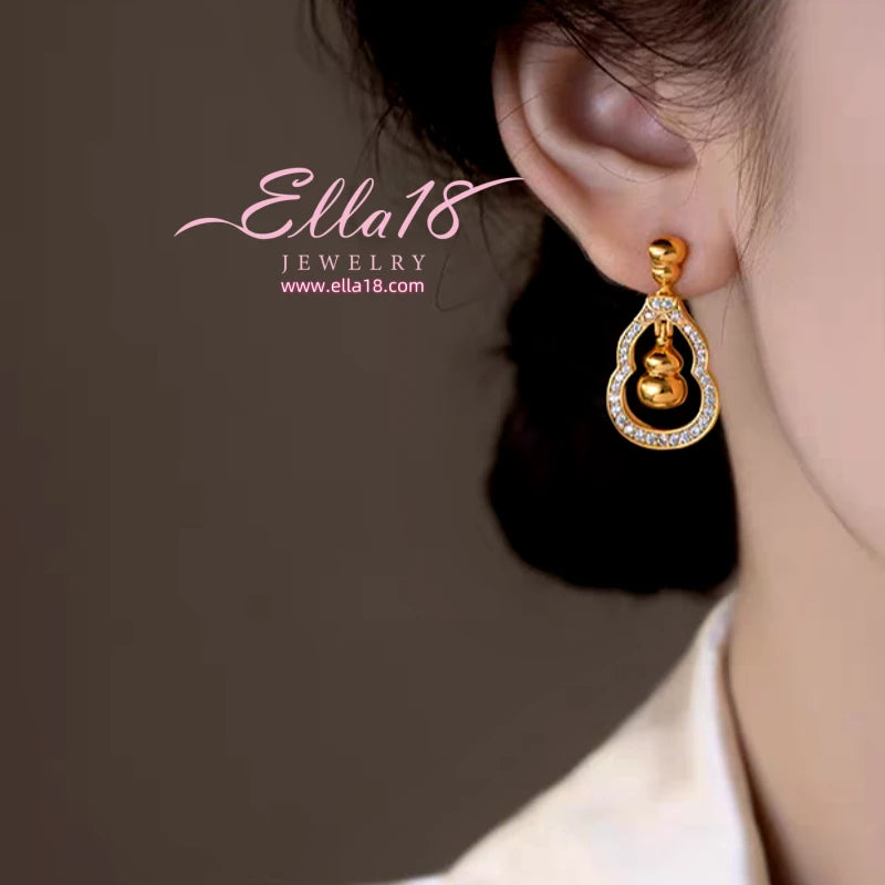 Close-up detail of the sparkling zircons and plating on the Gourd Diamond Earrings