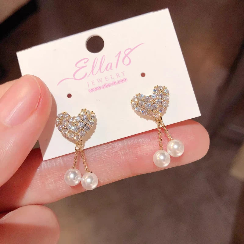 Close-up detail of the sparkling zircons and plating on the Heart Pearl Tassel
