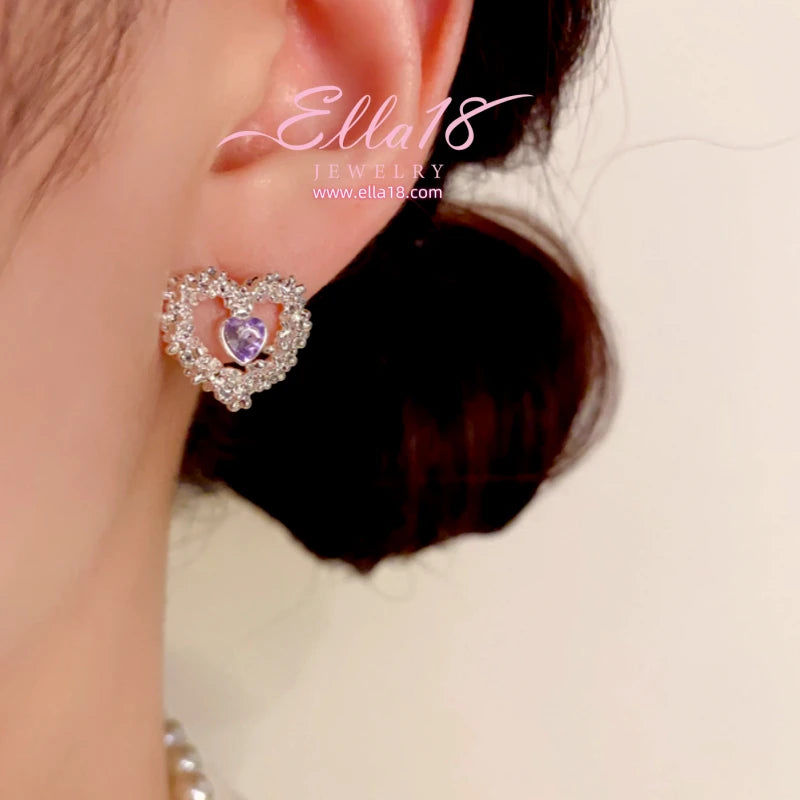 Model showcasing the dangle and style of the 14K Gold-Plated Luxury Zircon Diamond Hollow Heart Stud Earrings