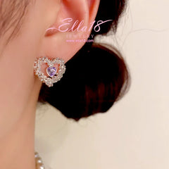 Model showcasing the dangle and style of the 14K Gold-Plated Luxury Zircon Diamond Hollow Heart Stud Earrings