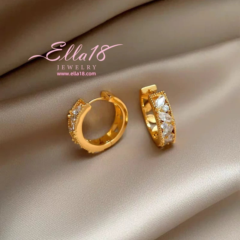 Model showcasing the dangle and style of the 14K Gold-Plated Luxury Zircon Diamond Hoop Earrings