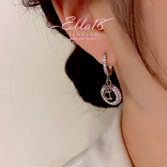 Angled view of the 14K Gold-Plated Luxury Zircon Diamond Letter D Earrings